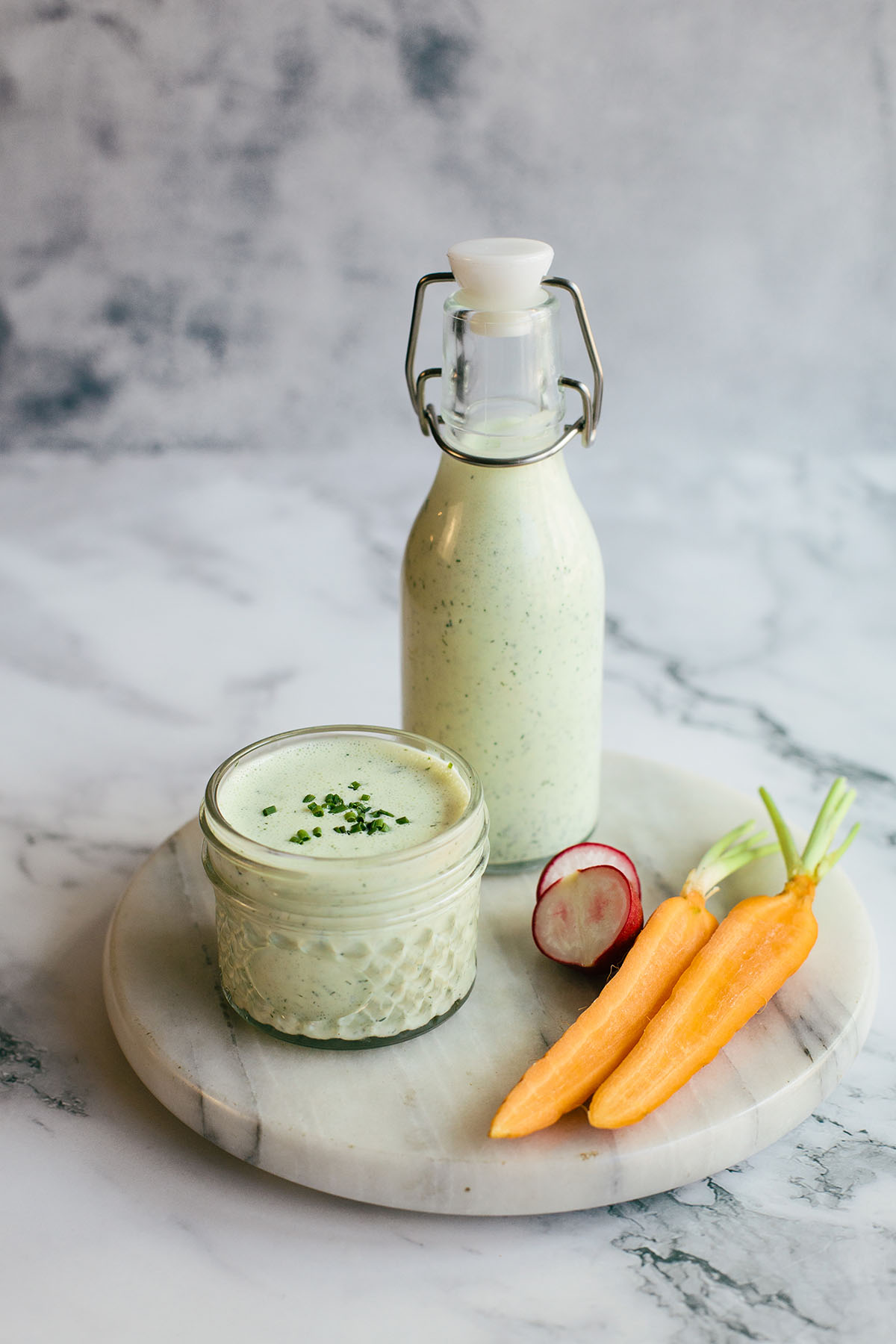 Homemade herby green goddess dressing in a bottle